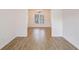 Bright dining room with wood-look flooring and a chandelier at 1547 Welch Ct, Suwanee, GA 30024
