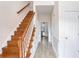 Welcoming foyer with hardwood staircase, wood-look flooring, and wainscoting at 1547 Welch Ct, Suwanee, GA 30024