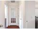Hallway with french doors, white trim, and wood-look floors at 1547 Welch Ct, Suwanee, GA 30024