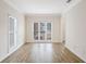 Spacious living room with large windows and wood-look flooring at 1547 Welch Ct, Suwanee, GA 30024