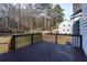 Backyard deck with wooden railings overlooking a grassy area at 1121 Kelvington Way, Lilburn, GA 30047