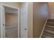 Carpeted stairway with white door at 139 Hampton Oaks Dr, Hampton, GA 30228