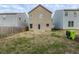 Tan house with backyard, wooden fence, and patchy grass at 5537 Union Pointe Pl, Union City, GA 30291