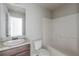 Simple bathroom with tub, shower, and vanity at 5537 Union Pointe Pl, Union City, GA 30291