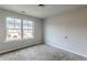 Well-lit bedroom with large window and carpet at 5537 Union Pointe Pl, Union City, GA 30291
