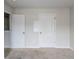 Spacious bedroom with two doors and carpet at 5537 Union Pointe Pl, Union City, GA 30291