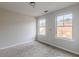 Bright bedroom with carpet and two windows at 5537 Union Pointe Pl, Union City, GA 30291