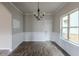 Bright dining room with hardwood floors and wainscoting at 5537 Union Pointe Pl, Union City, GA 30291