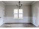 Dining room features hardwood floors and a chandelier at 5537 Union Pointe Pl, Union City, GA 30291