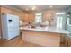 Bright kitchen with ample cabinets, an island, stainless steel appliances, and light countertops at 151 Dixon Cir, Fayetteville, GA 30215