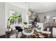 Dining area with a unique light fixture, large windows, and a view of the kitchen at 2034 Rockledge Ne Rd, Atlanta, GA 30324