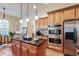 Well-appointed kitchen featuring stainless steel appliances, a center island, and granite countertops at 3213 Ashmore Ct, Conyers, GA 30094