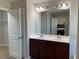 Double vanity bathroom with a large mirror and separate closet at 3372 Baylor Cir, Mcdonough, GA 30253