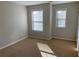 Bright bedroom with neutral walls and carpet at 3372 Baylor Cir, Mcdonough, GA 30253