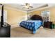 Spacious main bedroom with a king-size bed and ceiling fan at 345 Panhandle Pl, Hampton, GA 30228