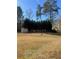 Yard with shed and tall trees providing privacy at 1276 Huntington Place Cir, Lithonia, GA 30058
