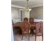 Formal dining room featuring a large wood table and chairs at 1276 Huntington Place Cir, Lithonia, GA 30058