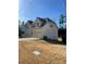 Two-story house with a two car garage and a large yard at 1276 Huntington Place Cir, Lithonia, GA 30058