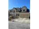 Two-story house with two-car garage and large windows at 1276 Huntington Place Cir, Lithonia, GA 30058