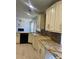 Modern kitchen with granite countertops and custom cabinetry at 1276 Huntington Place Cir, Lithonia, GA 30058