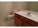 Bathroom with vanity sink, toilet, and mirror at 2800 Vining Ridge Ter, Decatur, GA 30034