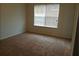 Bedroom featuring neutral walls, carpeted flooring, and a large window with blinds at 2800 Vining Ridge Ter, Decatur, GA 30034