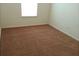 Empty bedroom with neutral walls and brown carpeting at 2800 Vining Ridge Ter, Decatur, GA 30034