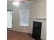 Living room with fireplace, sliding glass door, and blinds on the window at 2920 Vining Ridge Ter, Decatur, GA 30034