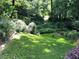 Large grassy backyard with mature trees and privacy at 3479 Chestnut Dr, Atlanta, GA 30340