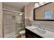 Modern bathroom with tiled shower, vanity, and updated fixtures at 3479 Chestnut Dr, Atlanta, GA 30340