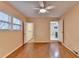 Bedroom with hardwood floors, ceiling fan, and access to a bathroom at 3479 Chestnut Dr, Atlanta, GA 30340