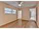 Spacious bedroom with hardwood floors, ceiling fan, and ensuite bathroom at 3479 Chestnut Dr, Atlanta, GA 30340