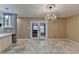 Dining room with tile floors, chandelier, and French doors at 3479 Chestnut Dr, Atlanta, GA 30340