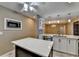 Kitchen with white cabinets, dark island with white countertop, and stainless steel appliances at 3479 Chestnut Dr, Atlanta, GA 30340