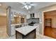 Modern kitchen with large island, white cabinets, and stainless steel appliances at 3479 Chestnut Dr, Atlanta, GA 30340