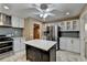 Bright kitchen with island, stainless steel appliances, and ample cabinet space at 3479 Chestnut Dr, Atlanta, GA 30340