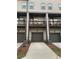 Back exterior of a townhome with balconies, garages, and driveway at 3963 Allegretto Cir, Atlanta, GA 30339