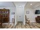 Entryway with white front door, wood-look tile, and views into the dining and living rooms at 138 Elysian Nw Way, Atlanta, GA 30327