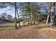 Wooded area with a view of the golf course at 138 Elysian Nw Way, Atlanta, GA 30327