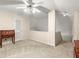 Carpeted loft space with desk, closet, and stairs leading down at 4907 Wilkins Station Dr, Decatur, GA 30035