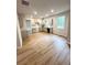 Open kitchen and dining area with wood-look flooring and modern grey cabinets at 66 Pine Creek Ct, Dallas, GA 30157