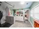 Stylish bathroom with a walk-in shower, dual vessel sinks, and updated finishes at 770 Rochelle Sw Dr, Atlanta, GA 30310