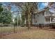 Fenced backyard with a grassy area and a view of the back of the home at 1419 Orange Blossom Se Ter, Atlanta, GA 30316