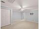 Bright bedroom with ceiling fan and neutral carpeting at 7115 Shady Oak Ln, Cumming, GA 30040