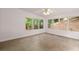 Sunroom featuring large windows and tile flooring at 7115 Shady Oak Ln, Cumming, GA 30040