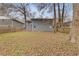 View of the backyard and the rear exterior of a gray two-story home at 331 E Rhinehill Se Rd, Atlanta, GA 30315