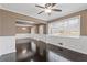 Spacious living room with dark hardwood floors, a ceiling fan, and large windows at 331 E Rhinehill Se Rd, Atlanta, GA 30315