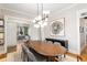 Stylish dining room featuring an oval table, modern chandelier, and wall art at 275 Hampton Ne Ter, Atlanta, GA 30307