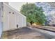 Backyard with storage shed and large tree at 3936 Hancock Cir, Atlanta, GA 30340