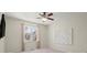 Bedroom with carpeted floors, ceiling fan, and large window at 3640 Sentry View Trce, Suwanee, GA 30024